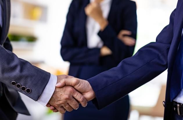 Handshake between people in suits