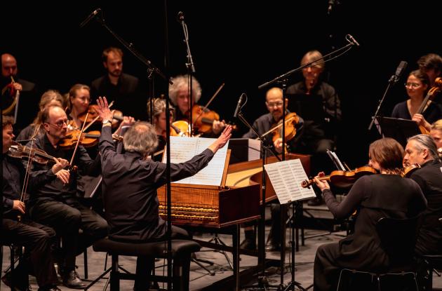 Orchestra with conductor and strings